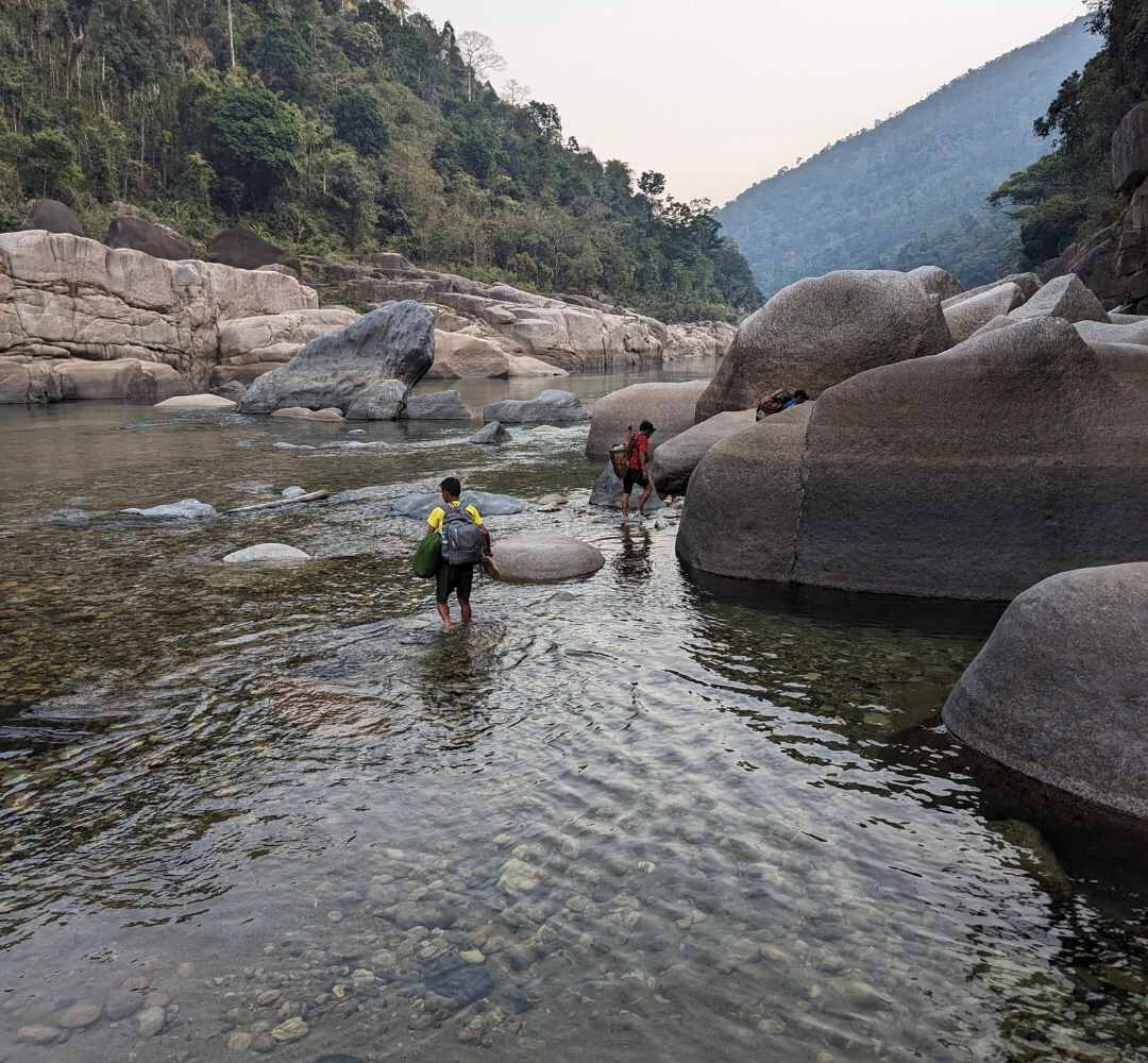 Crossing a river during a trek from pynter to amkoi