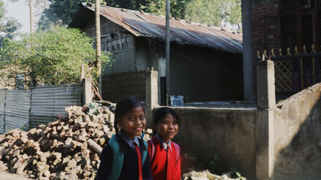 Two shy and enthusiastic kids in Majuli