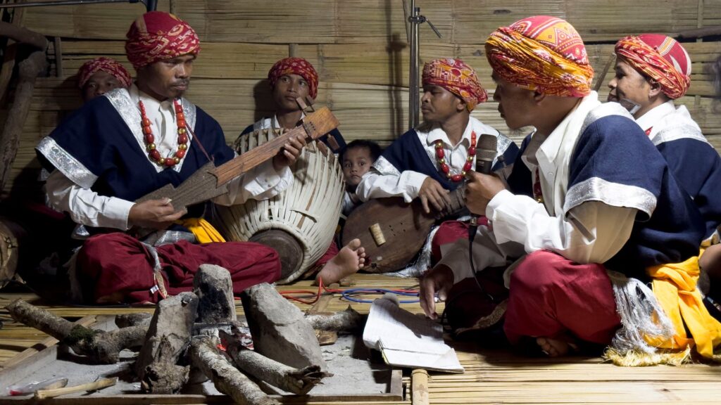 Khasi folk musicians playing drums and string instruments.