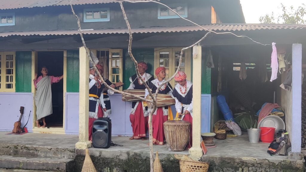 Khasi folk musicians playing drums and string instruments.
