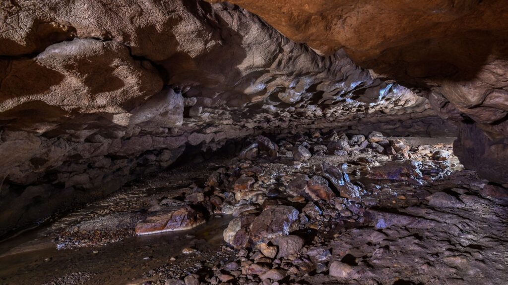 Low ceiling limestone cave passage