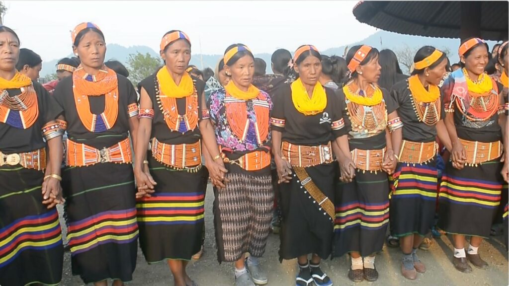 Konyak women in traditional attire performing group dance.