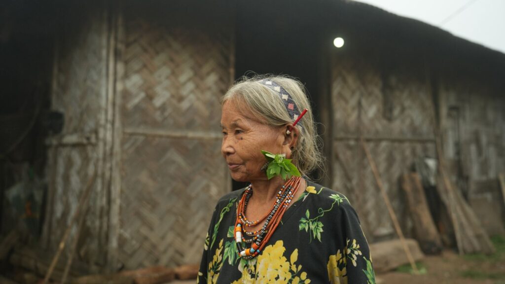 Elderly woman with traditional adornments