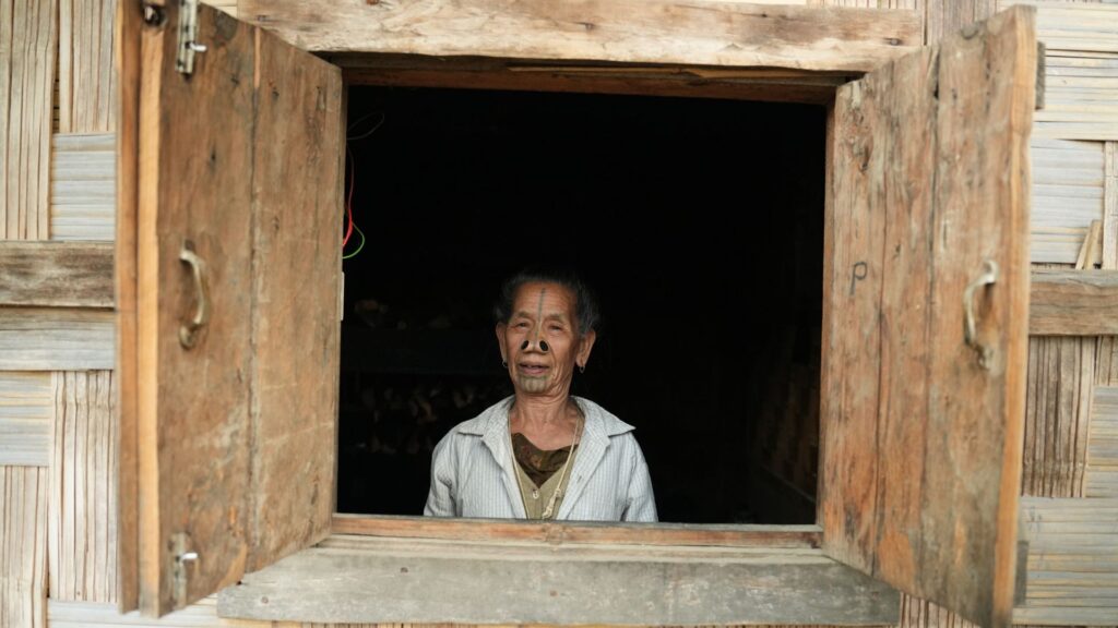 Elder woman with facial tattoos smiling