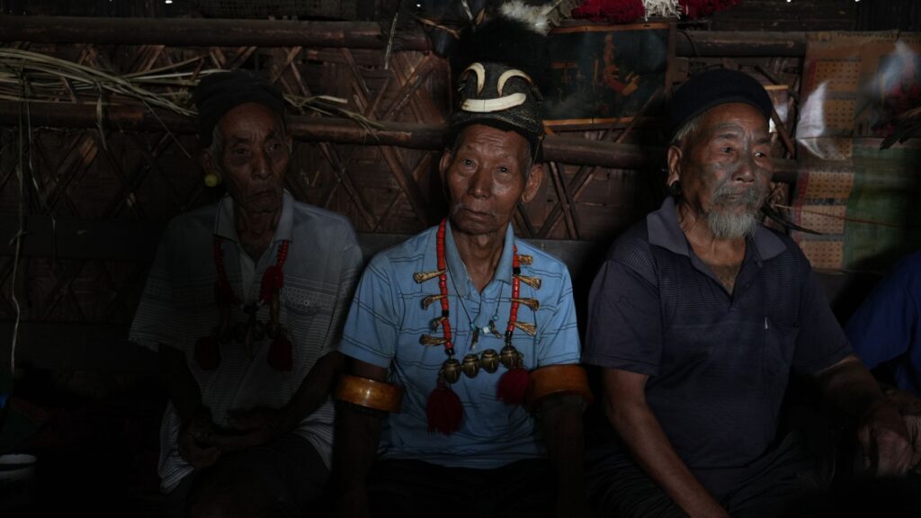 Portrait of elderly Konyak man with facial tattoos