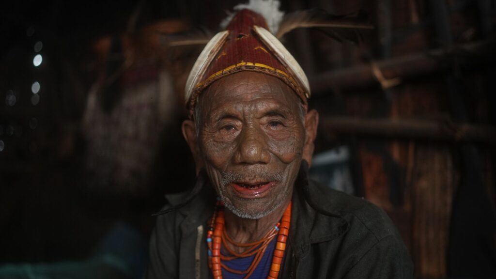 Portrait of smiling tattooed Konyak elder