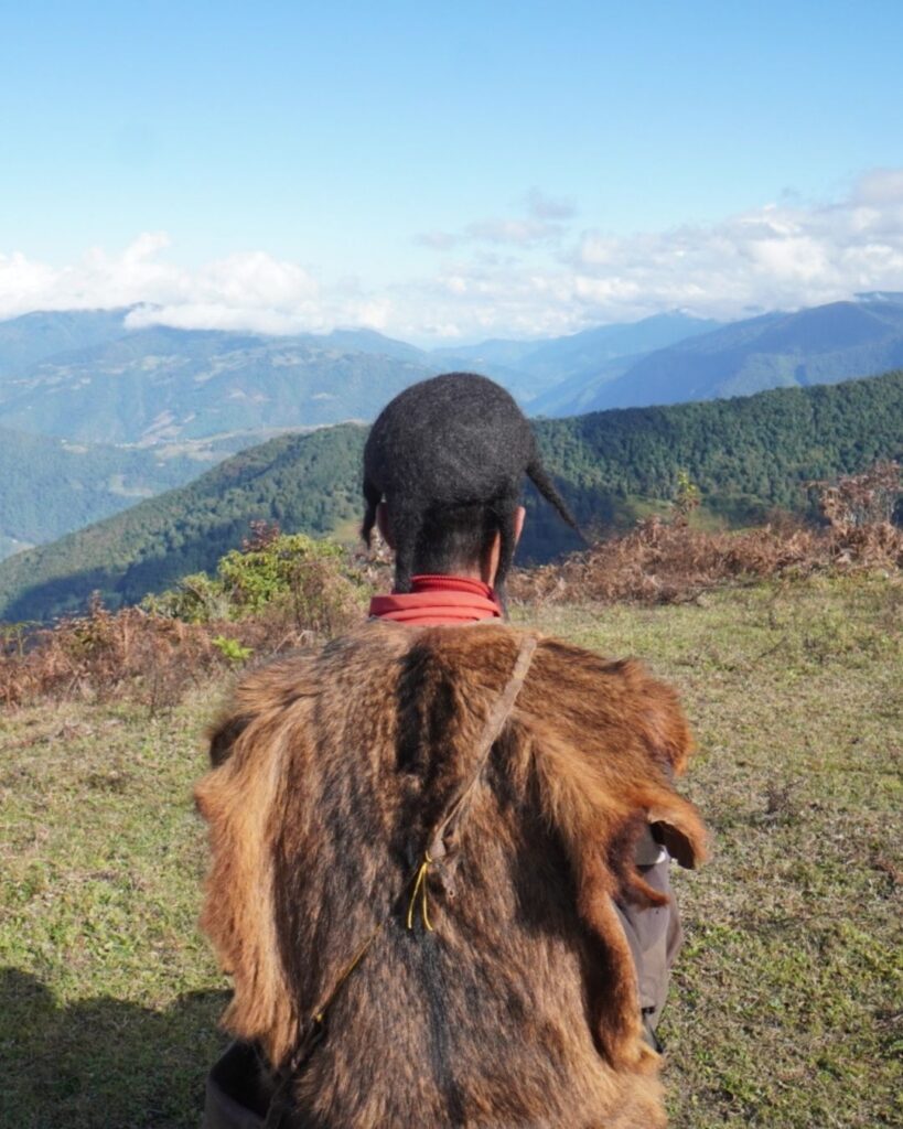 Brokpa herder overlooking Lu Brang Valley in Eastern Himalayas