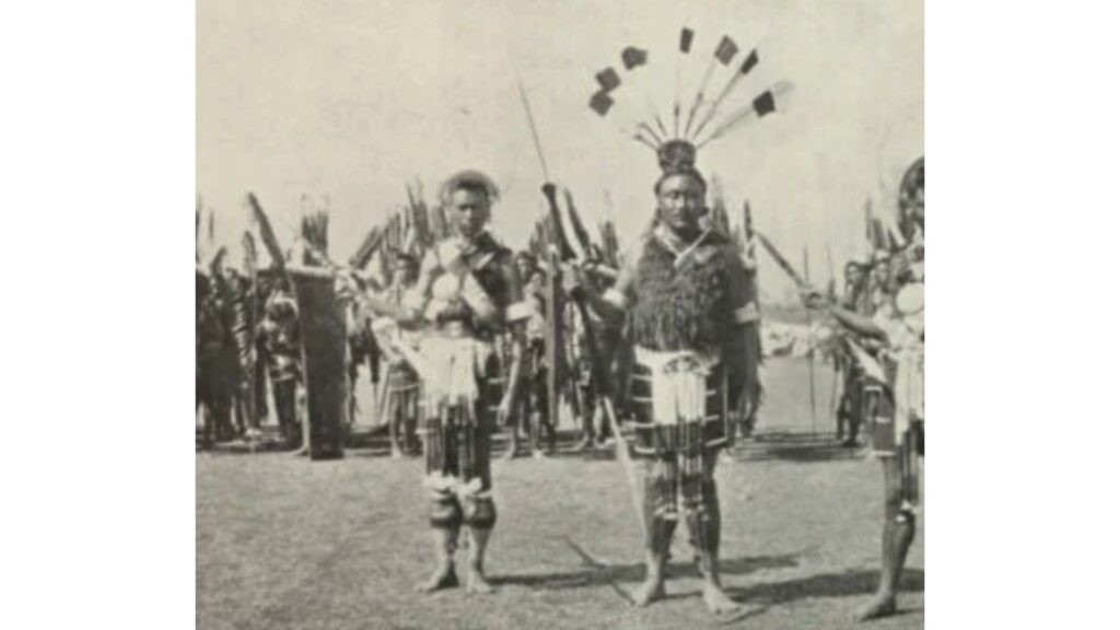 Naga warriors in ceremonial dress holding spears and shields