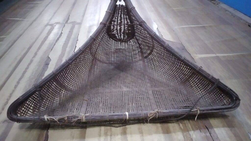 Traditional woven bamboo fishing net
