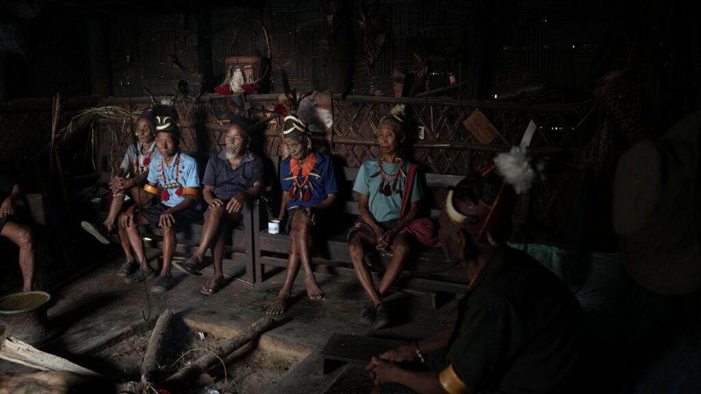 Naga Elders seated inside village home