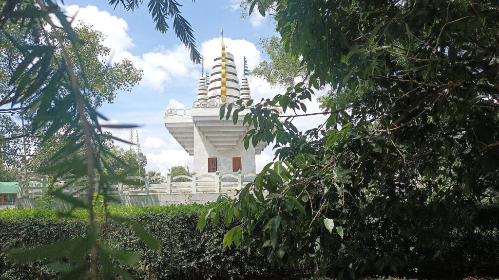 Temple framed by forest leaves